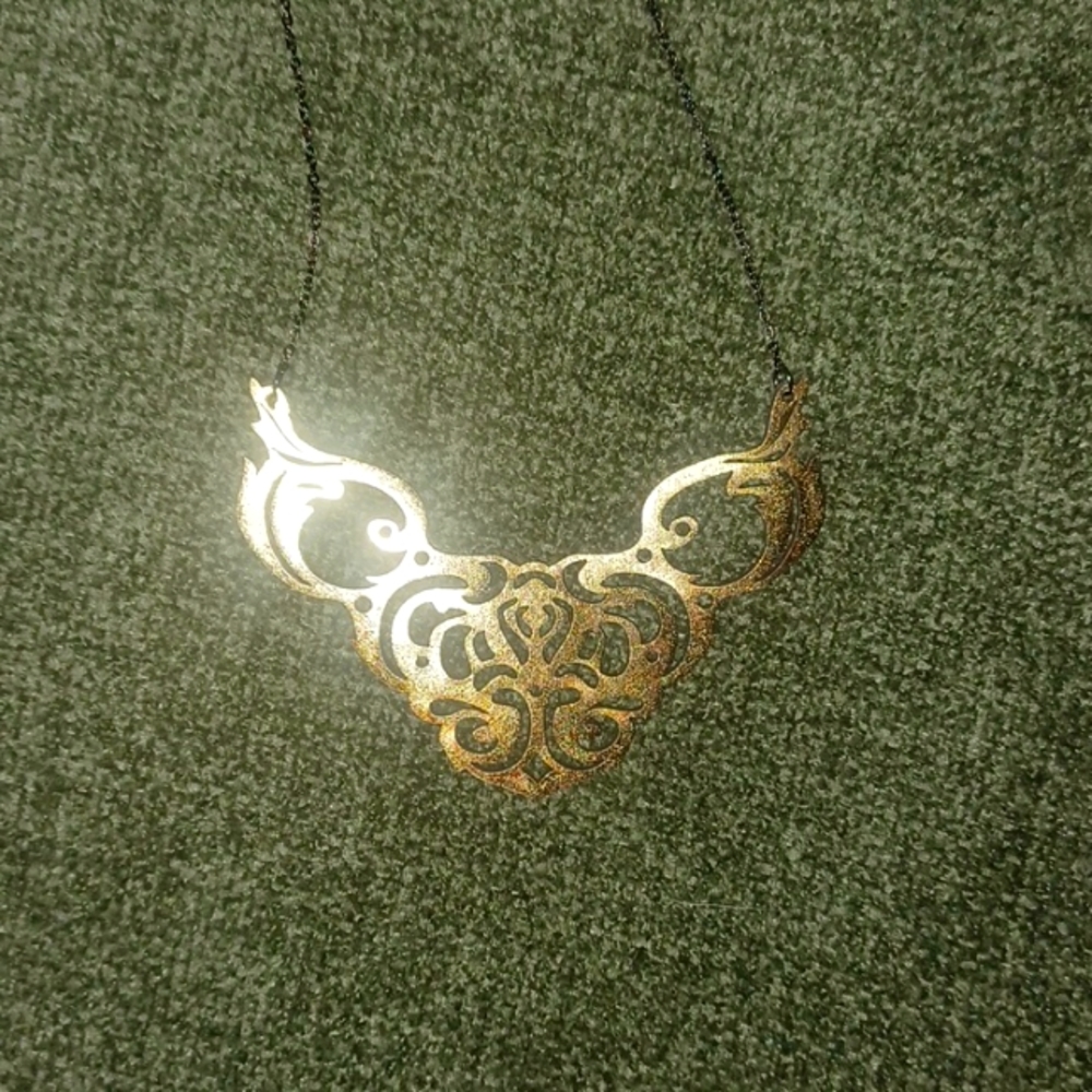 Really cool, unique Doury necklace gold coated nvr worn, new